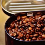 A ceramic canister of roasted beans on a kitchen counter, ready to store coffee beans at home