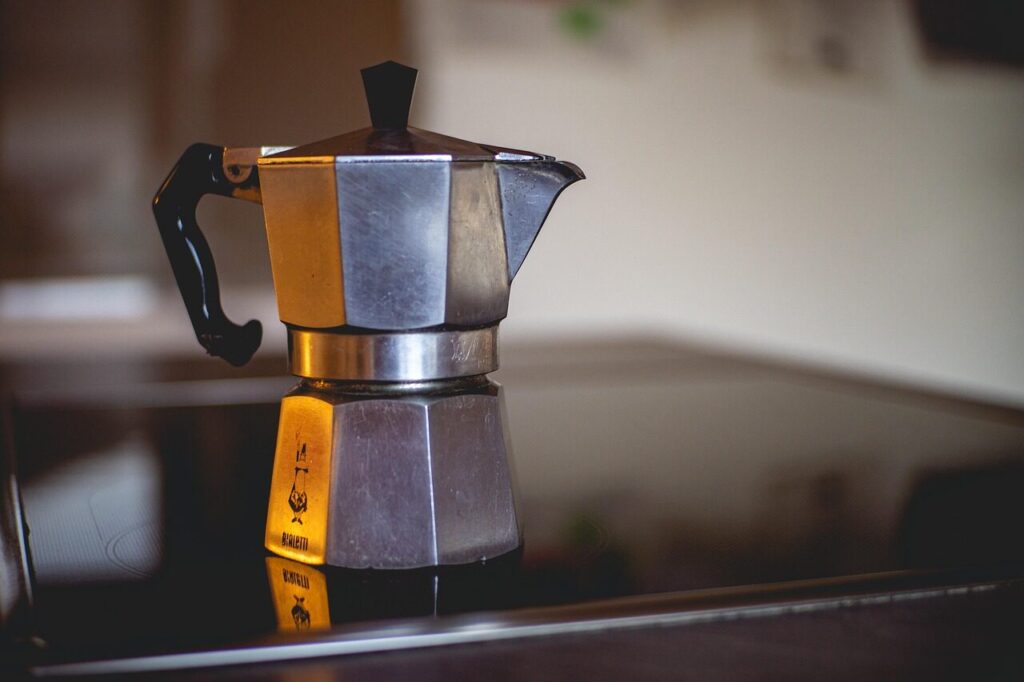 French press and moka pot sitting side by side on a kitchen counter